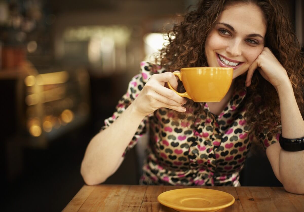 A woman drinking vegan coffee