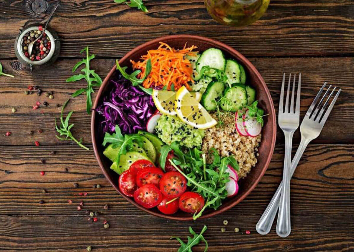 A colorful plate filled with vibrant fruits, vegetables, and plant-based proteins, showcasing the health and variety of a vegetarian diet."
