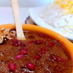 Savor the rich flavors of vegan Fesenjan stew, a Persian delicacy with walnuts, mushrooms, and pomegranate.
