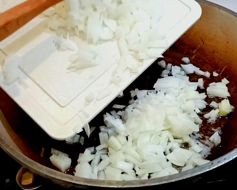 Chop an onion and fry it with a bit of oil.